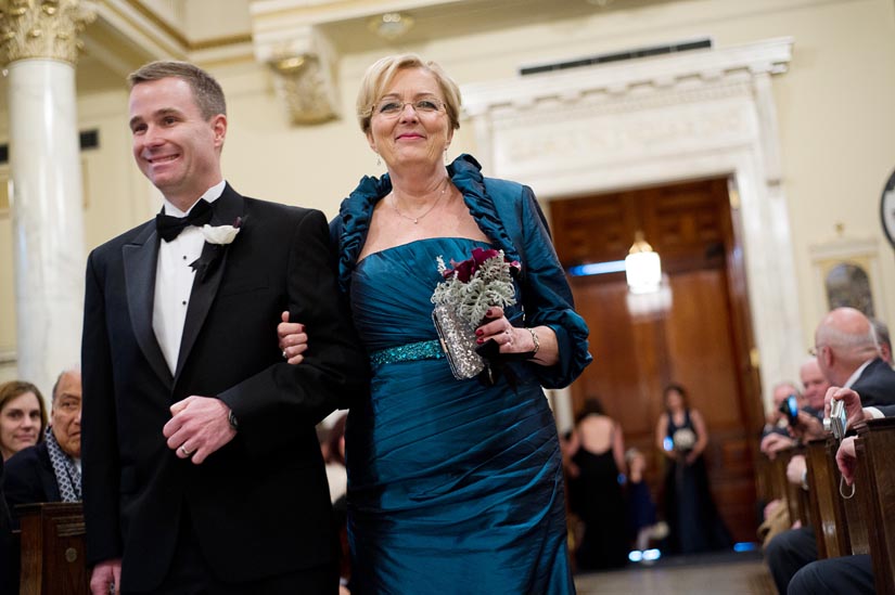 parents of the bride walk down the aisle