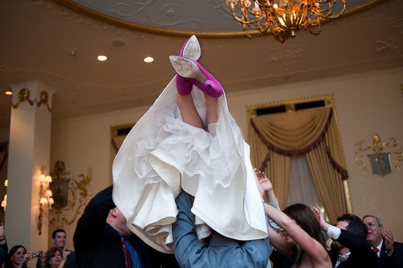 bride being carried by crowd