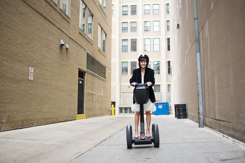 emilie-zack-wedding_044 bride riding a segway