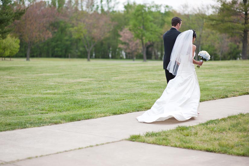 bride and groom walking away at quantico chapel
