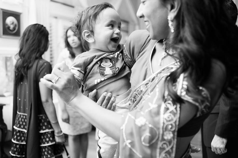 little baby laughing at wedding reception