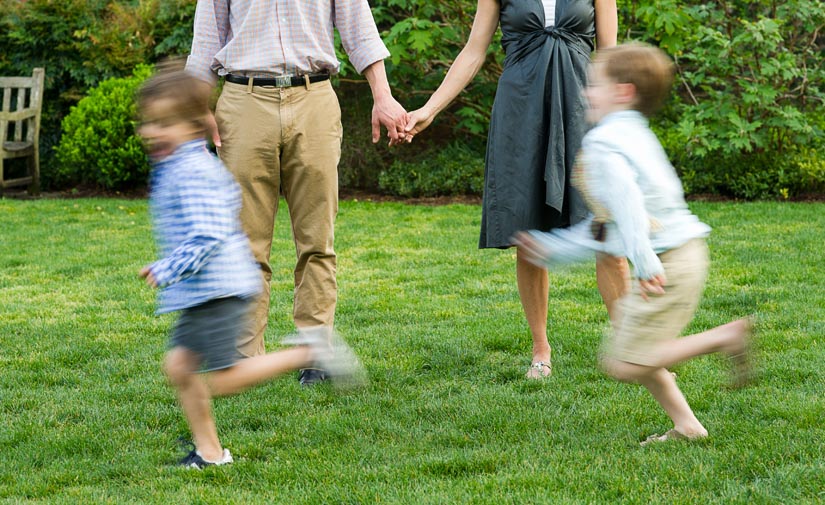 boys running during engagement session