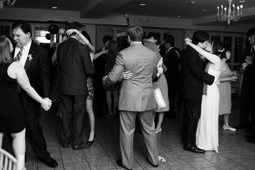 bride and groom share a last dance at the wedding reception