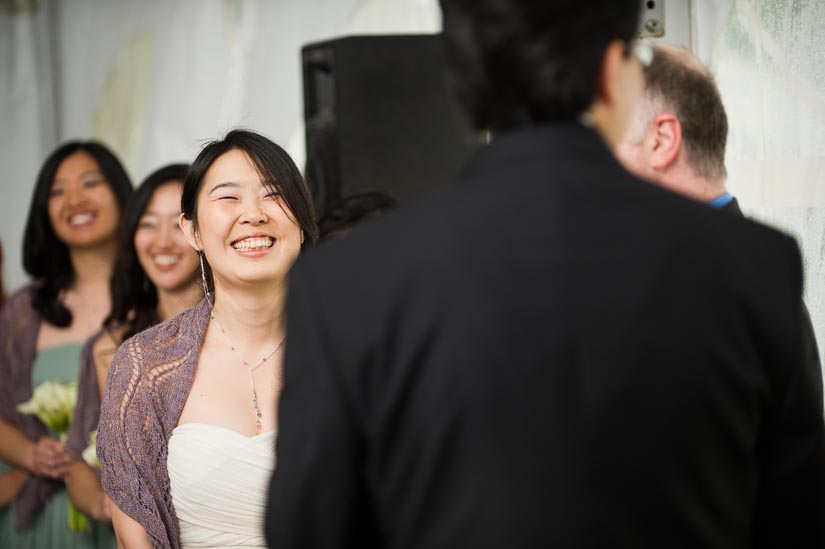 bride laughing during wedding ceremony