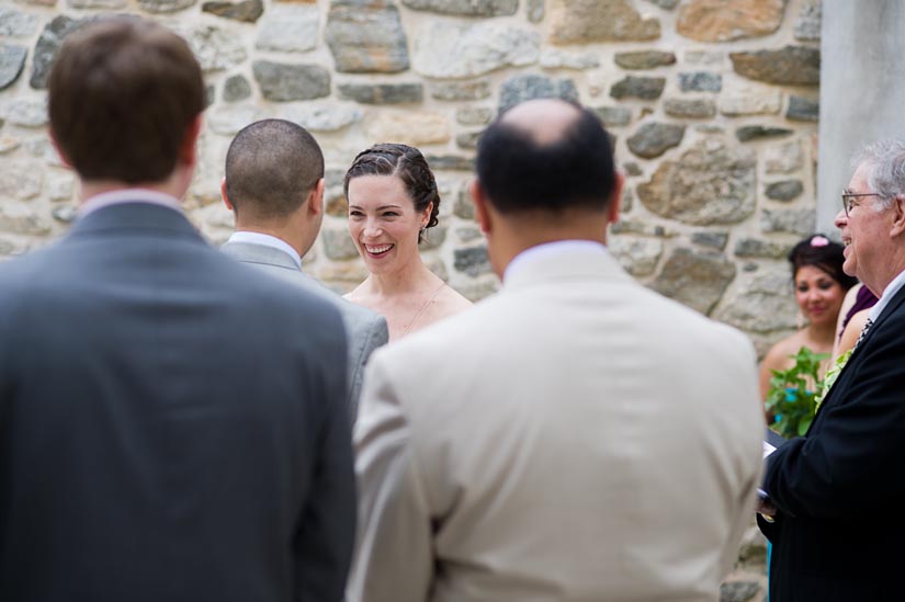 bride laughing during wedding ceremony