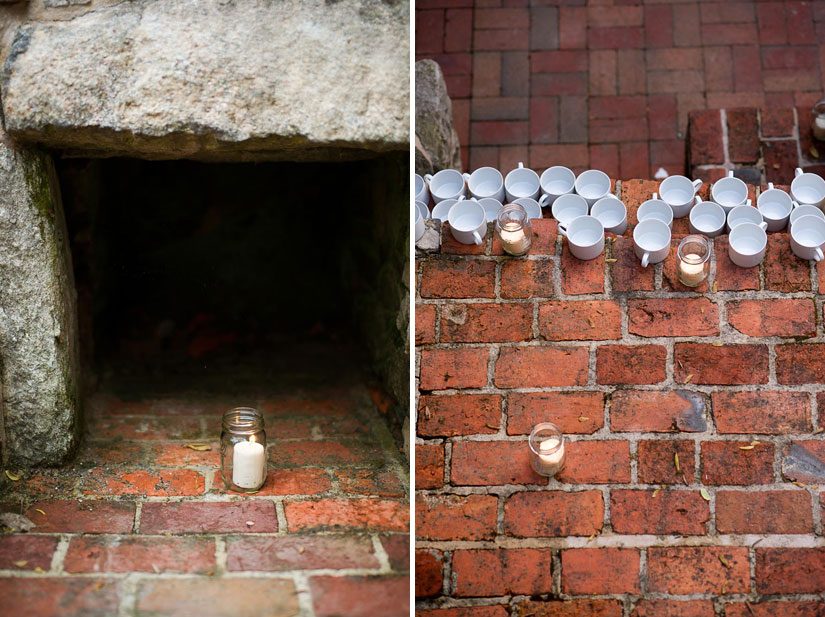 reception decor with red brick and white candles