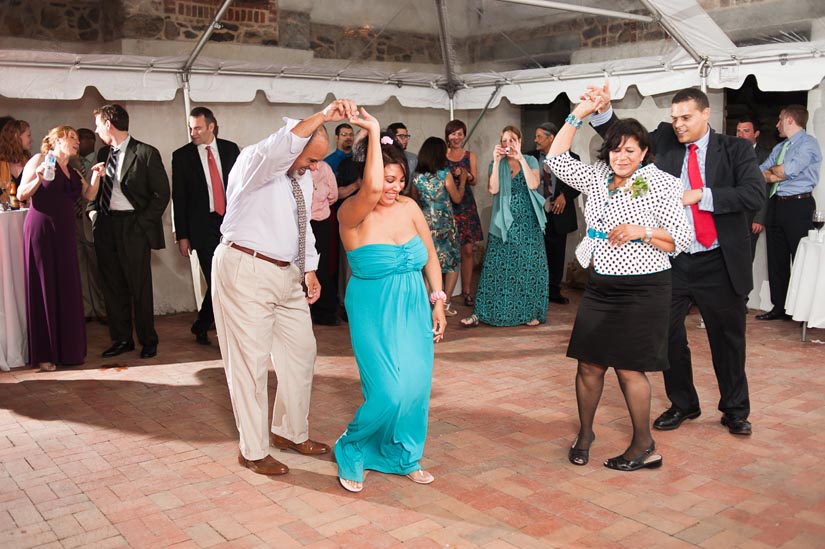 groom's family dancing at the wedding reception