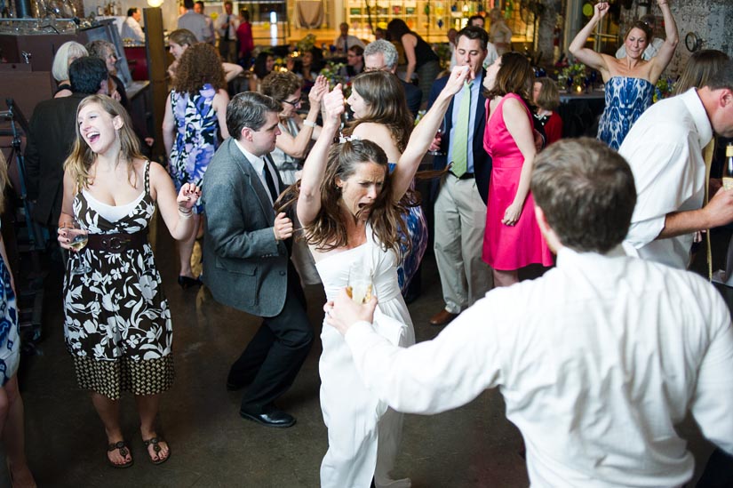 bride dancing during wedding reception at corradetti glass studio