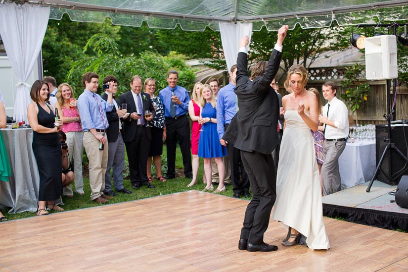 bride and groom rocking out during first dance