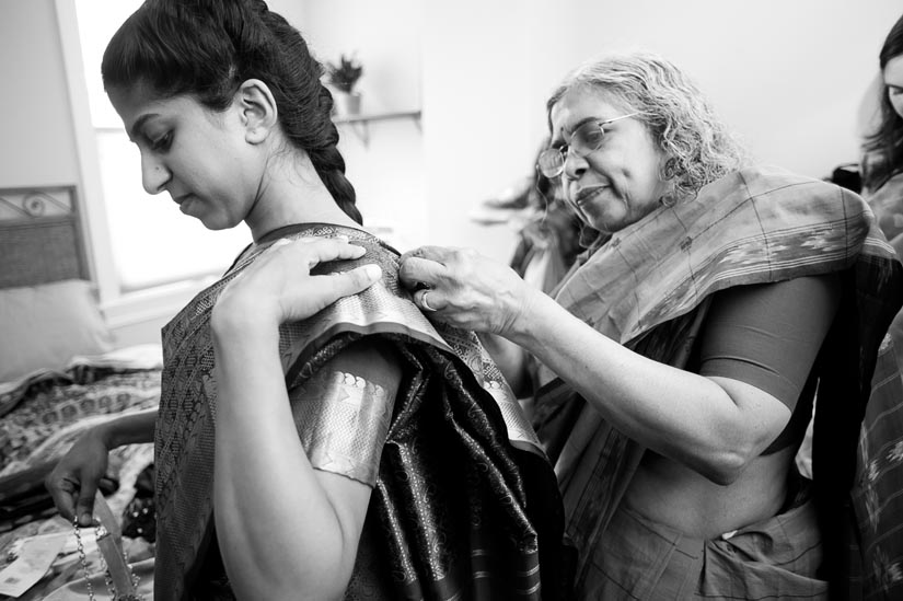 mom fixes her daughters sari