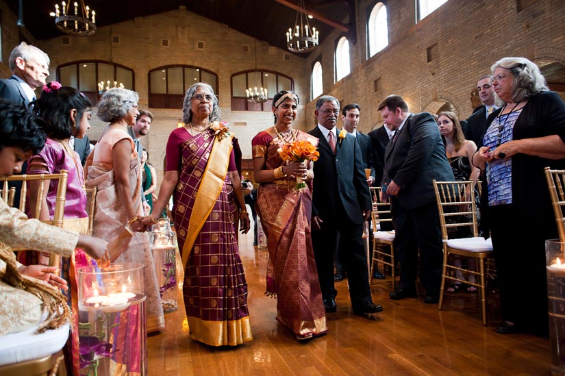 bride walking down the aisle at st. francis hall