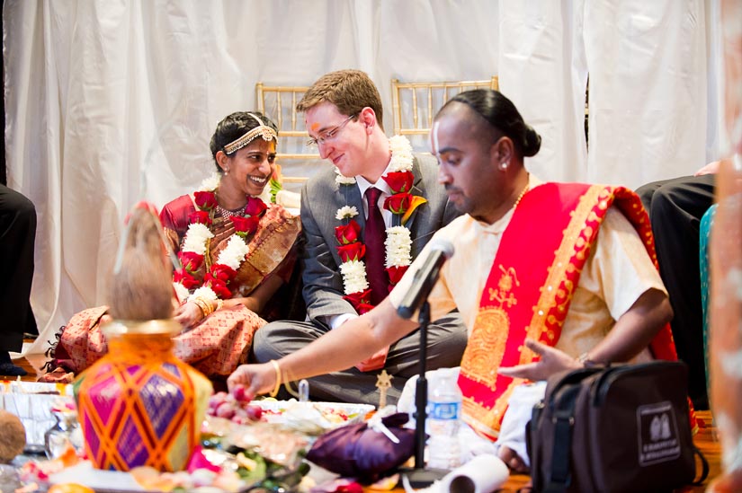 bride and groom laughing during indian wedding ceremony