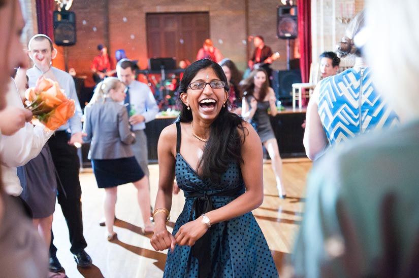 sister of the bride dancing at st. francis hall