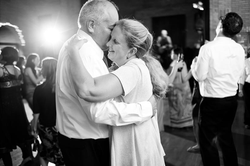 mother and father of the groom dancing at wedding reception
