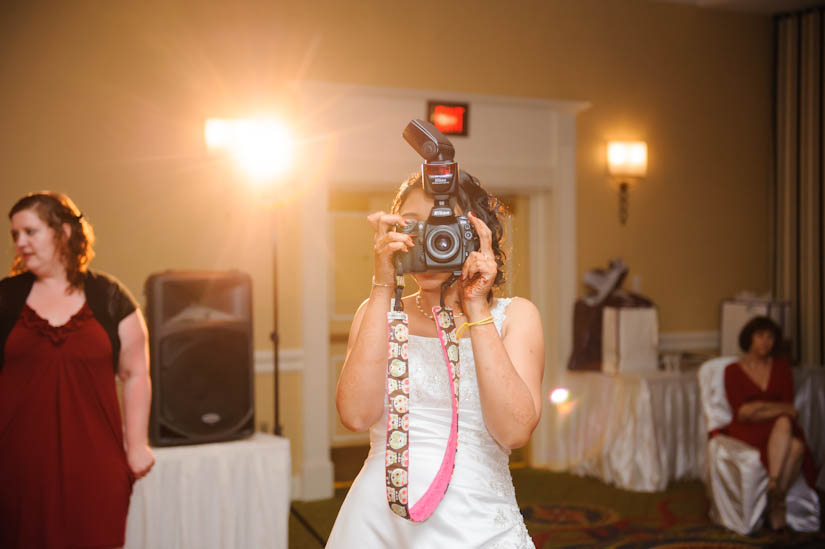 bride takes the photographer's camera