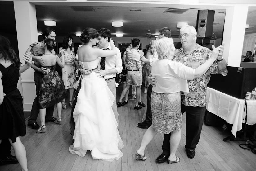 bride and groom dancing together at the end of the wedding