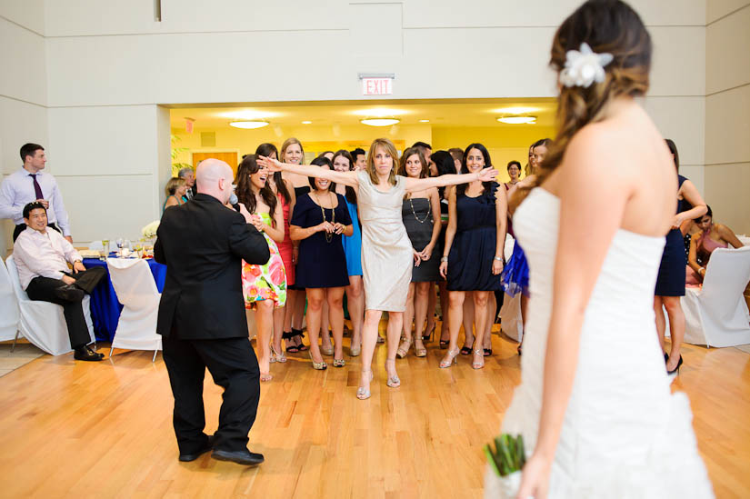mother of the bride goes for the bouquet