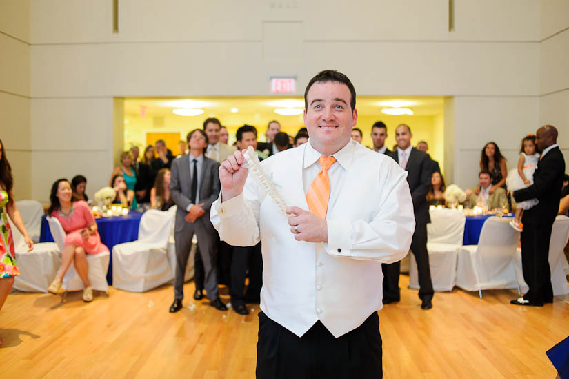 garter toss at levine museum of the new south wedding