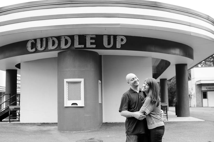 engagement session with glen echo park "cuddle up" sign