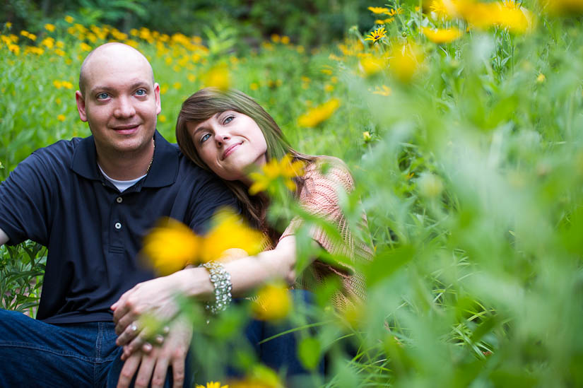 couple in a field of wildflowers at glen echo park