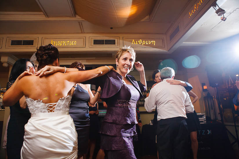 bride and her mom dancing at greek wedding