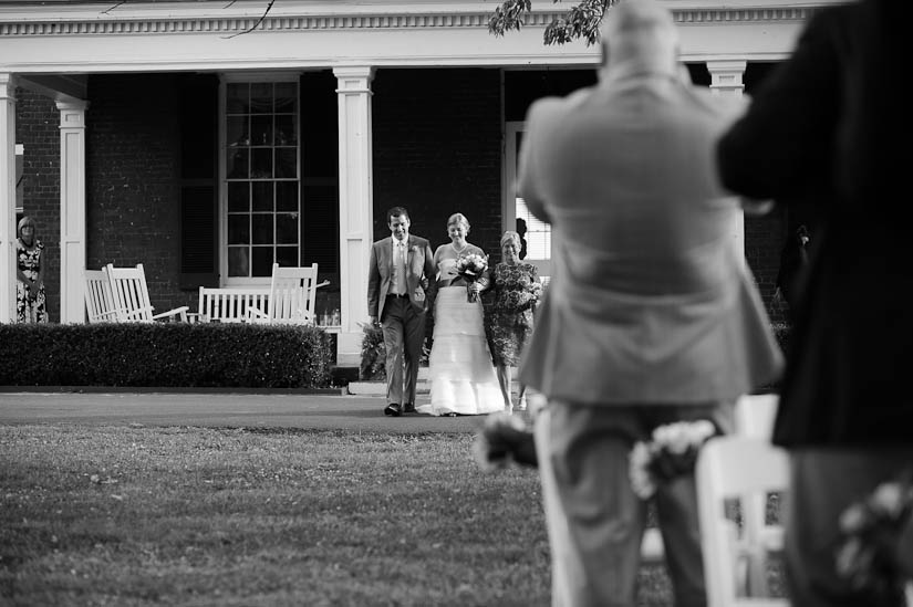 bride walking down the aisle at marriott ranch wedding