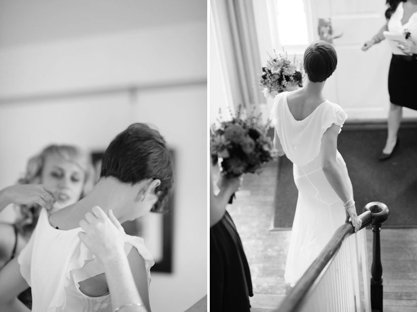 putting on her dress at woodlawn manor wedding