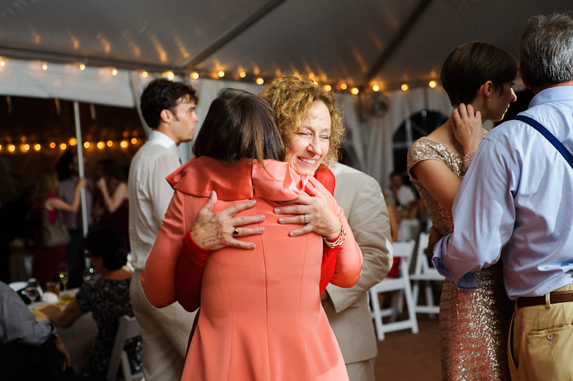 mothers hug each other at woodlawn wedding reception