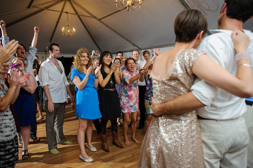 everybody clapping and laughing for bride and groom