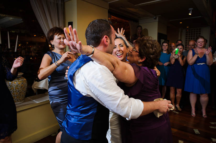 hugging after the drunken man dance at washington dc greek wedding