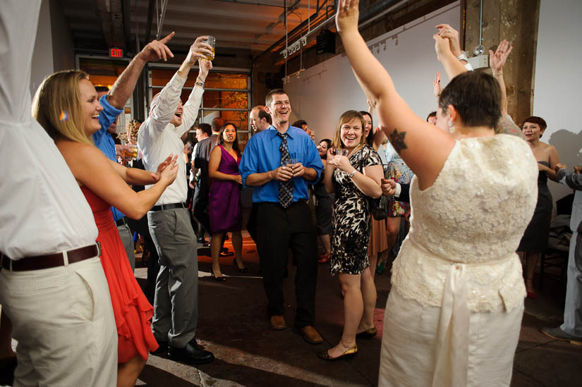 everybody cheering at longview gallery wedding reception