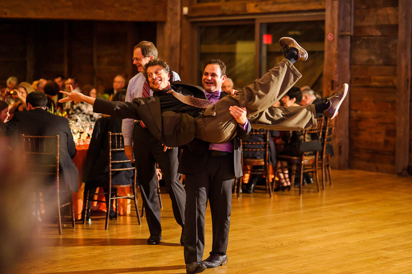 the groom carrying a guest