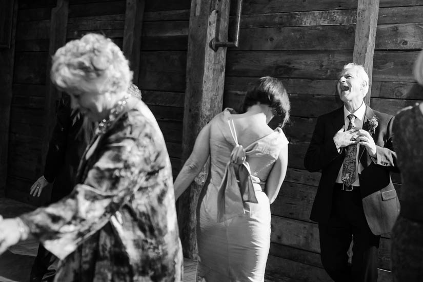parents of the groom laughing during the barns at wolf trap wedding reception