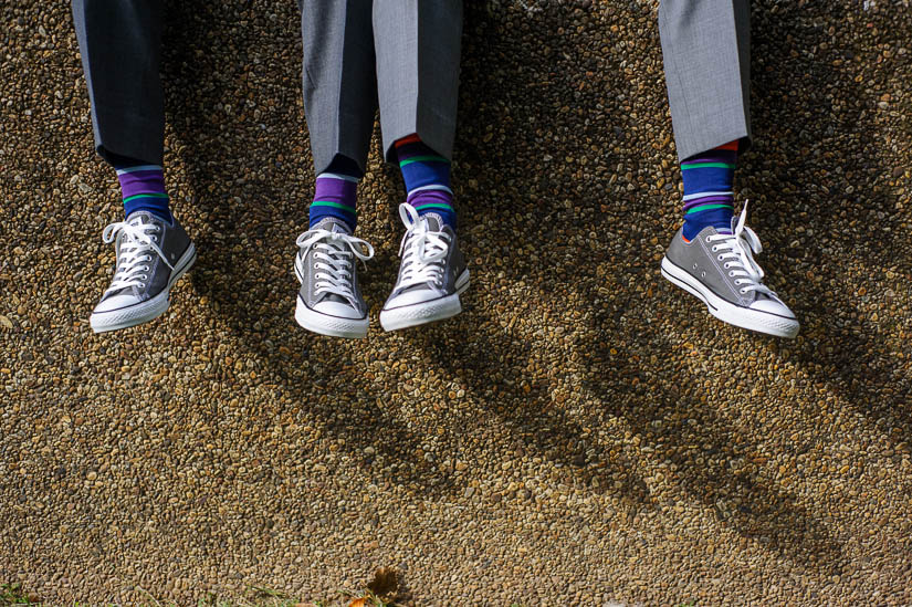 gray converse and purple striped socks for the wedding