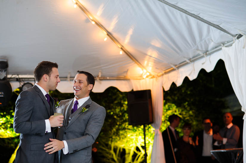 grooms giving speeches during wedding reception