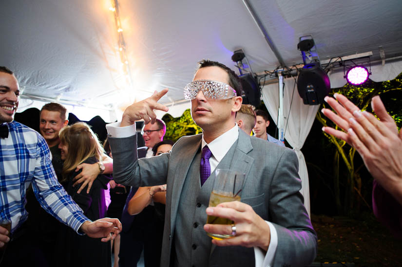 groom partying at the wedding reception