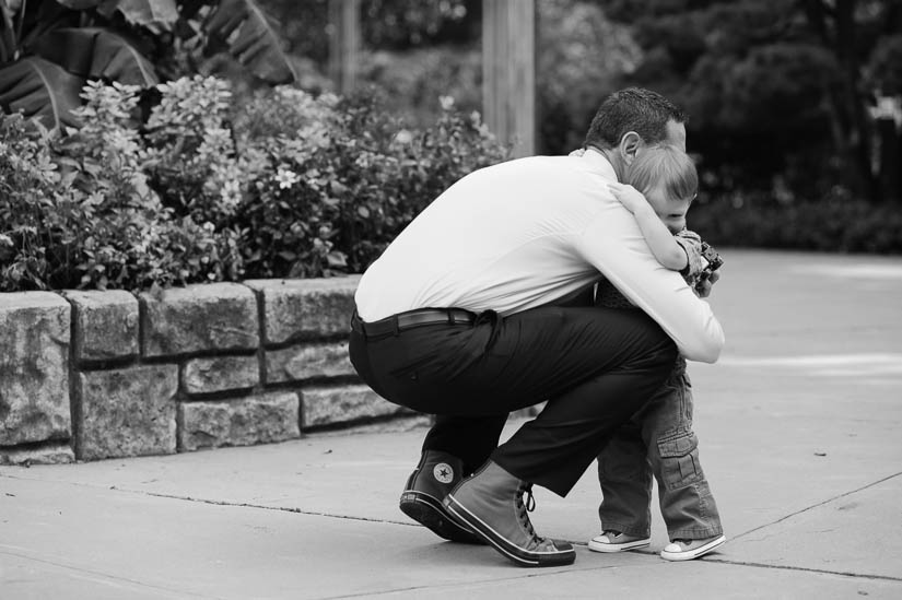 little boy hugging his dad at brookside gardens wedding