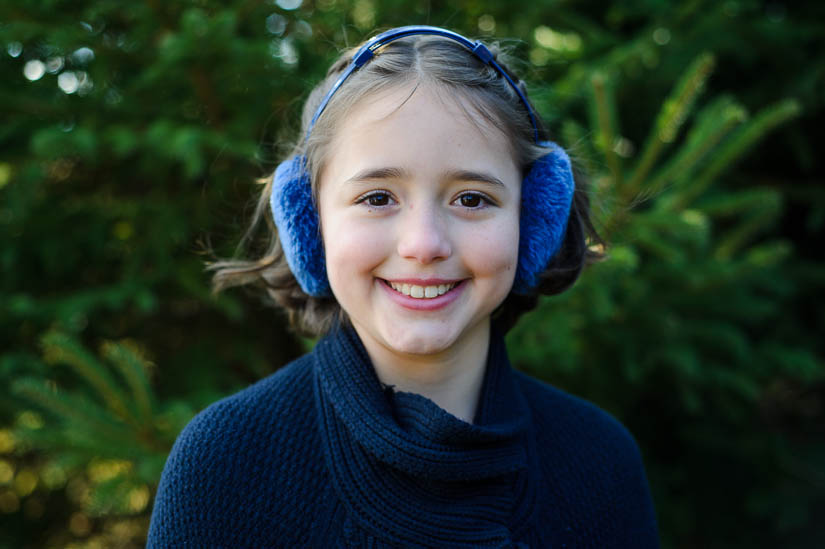 adorable little girl at christmas tree farm