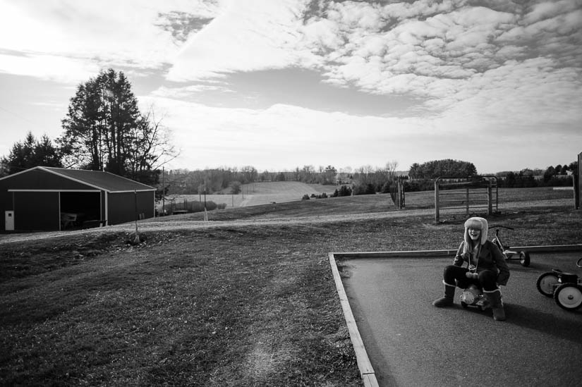 kids playing at mini playground at christmas tree farm