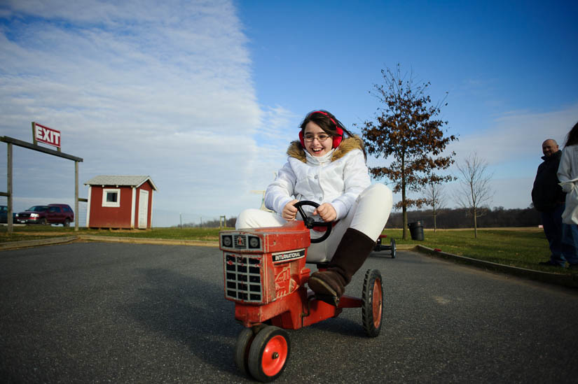 driving the tiny tractor at christmas tree farm