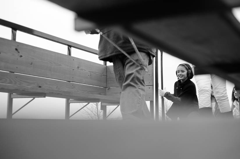 getting on the hay ride during a documentary family portrait session