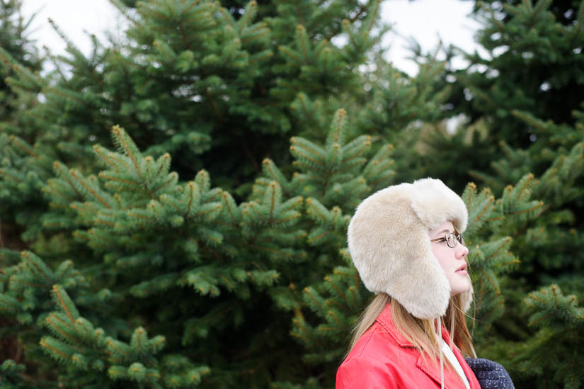 walking through the christmas trees during documentary family shoot