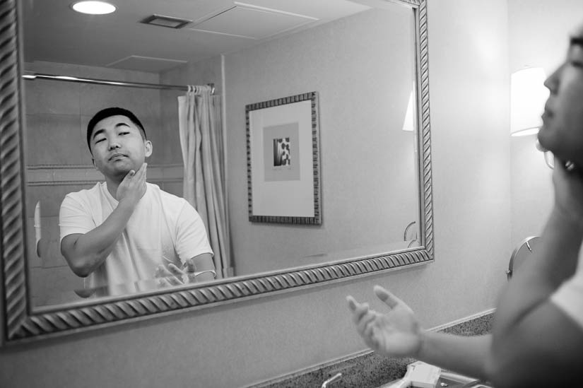 groom shaving before the wedding