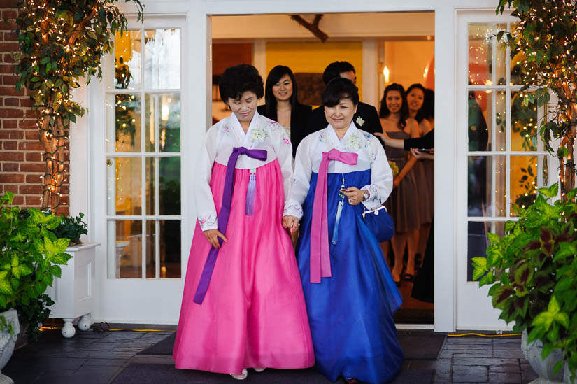 korean mothers in pink and blue dresses for the wedding