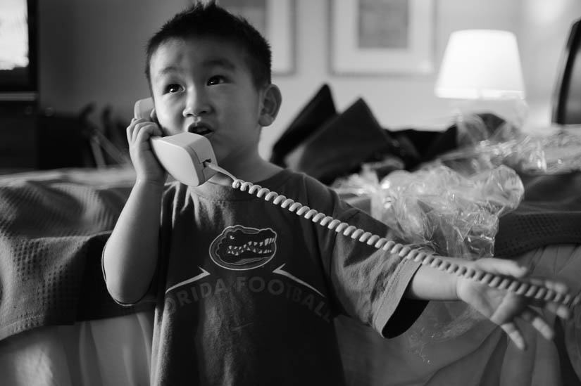 little boy making a phone call before the wedding