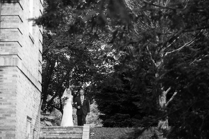 bride entering the wedding ceremony at st. francis hall