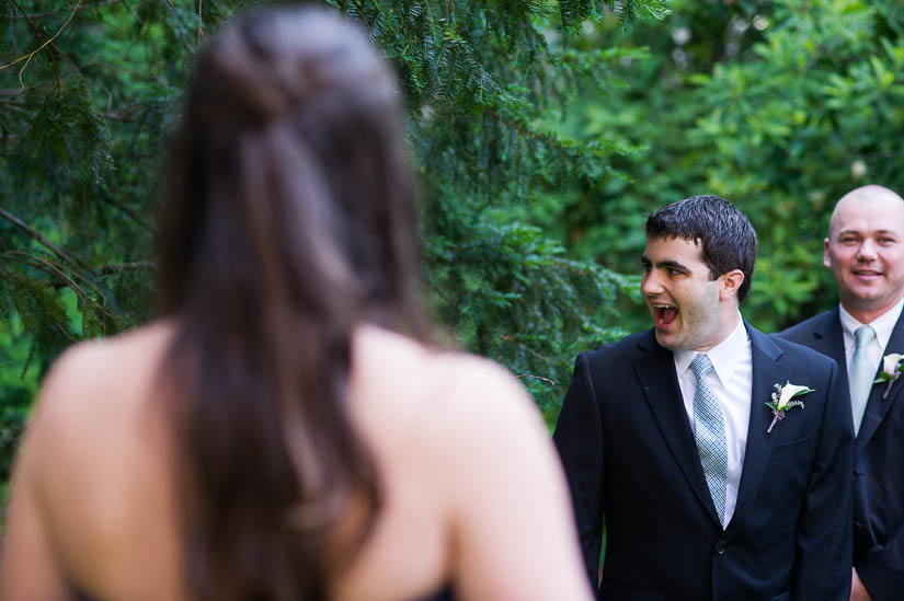 groom seeing his bride for the first time at st. francis hall wedding