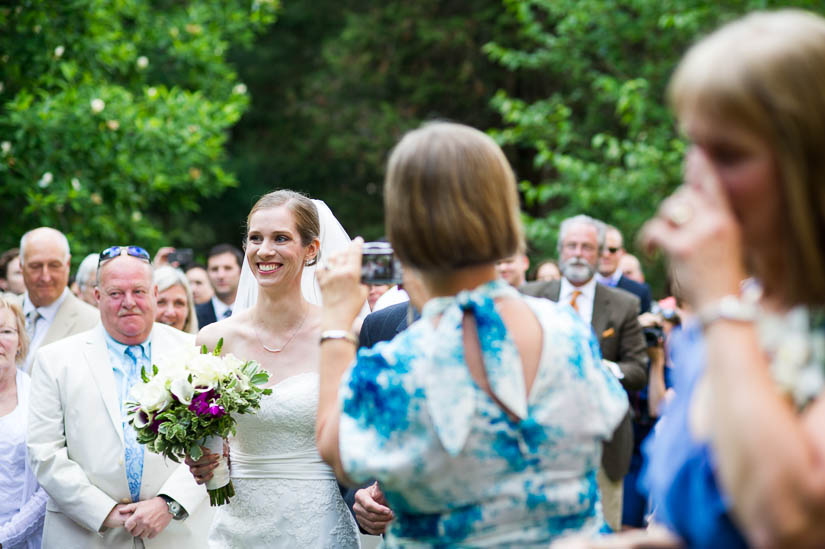 bride walking down the aisle outside