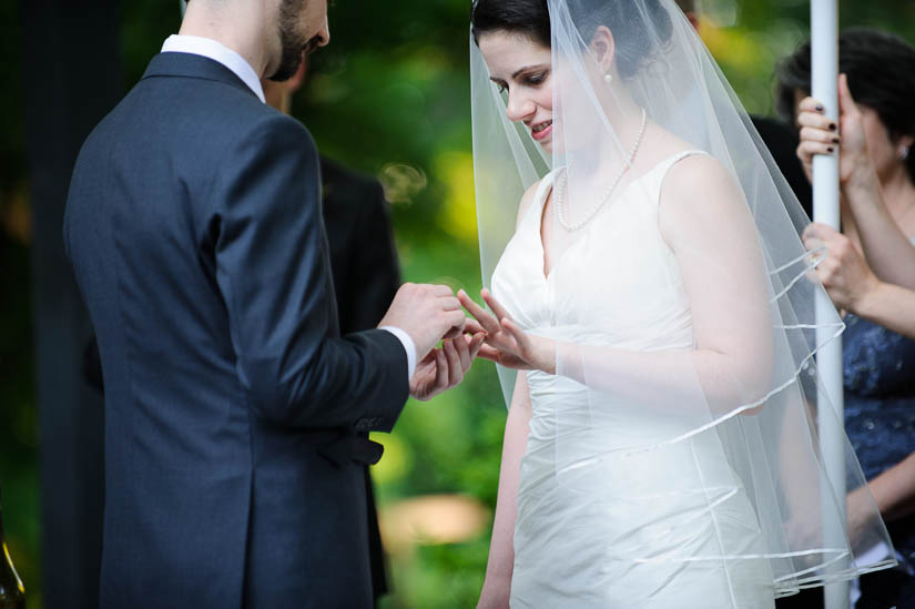 putting on the rings at the baltimore museum of art wedding