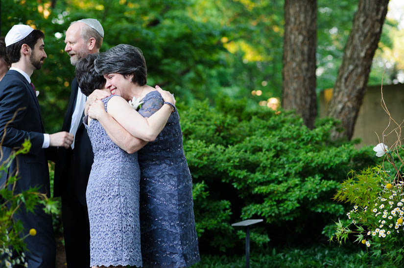 moms hugging at the baltimore museum of art wedding